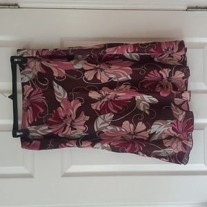 Brown knee length skirt with pink, maroon, and mauve flowers size large